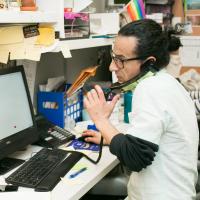 A man speaking on the phone.